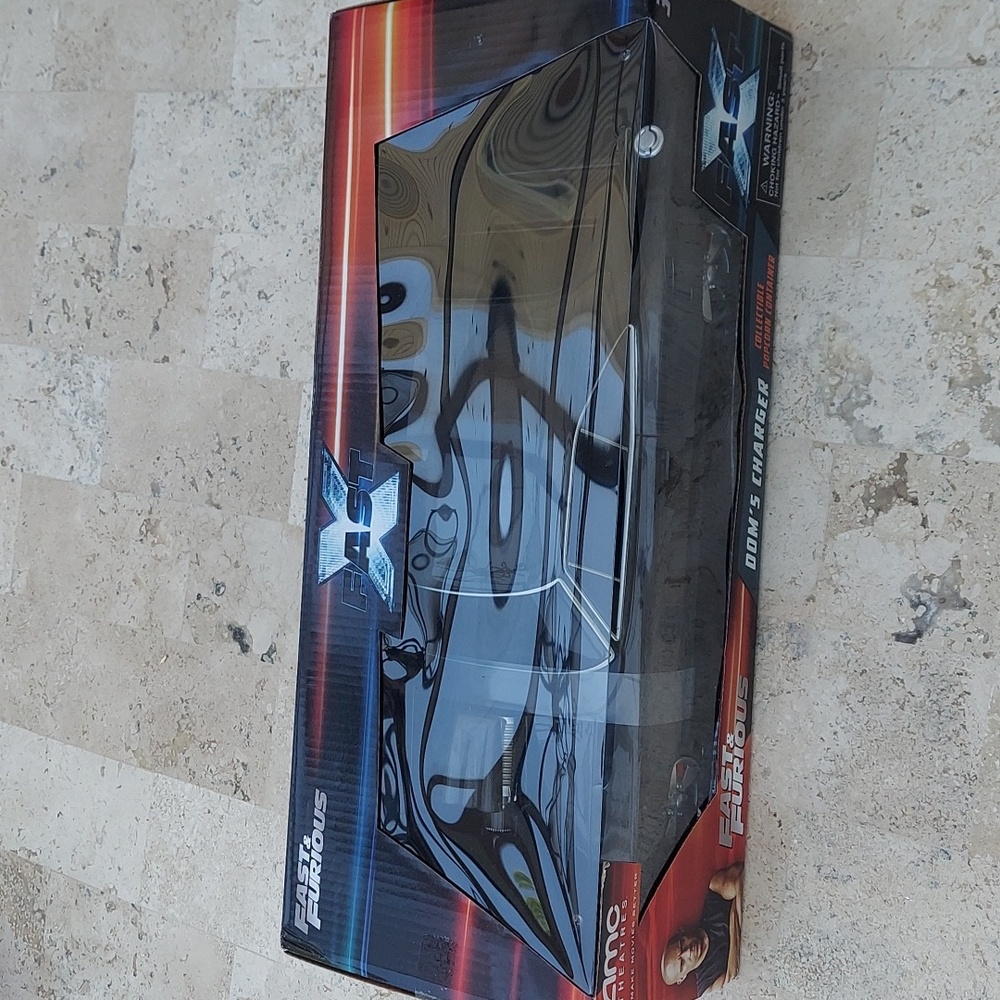 Amc theaters collectable popcorn container. Fast X does charger, dated 2022